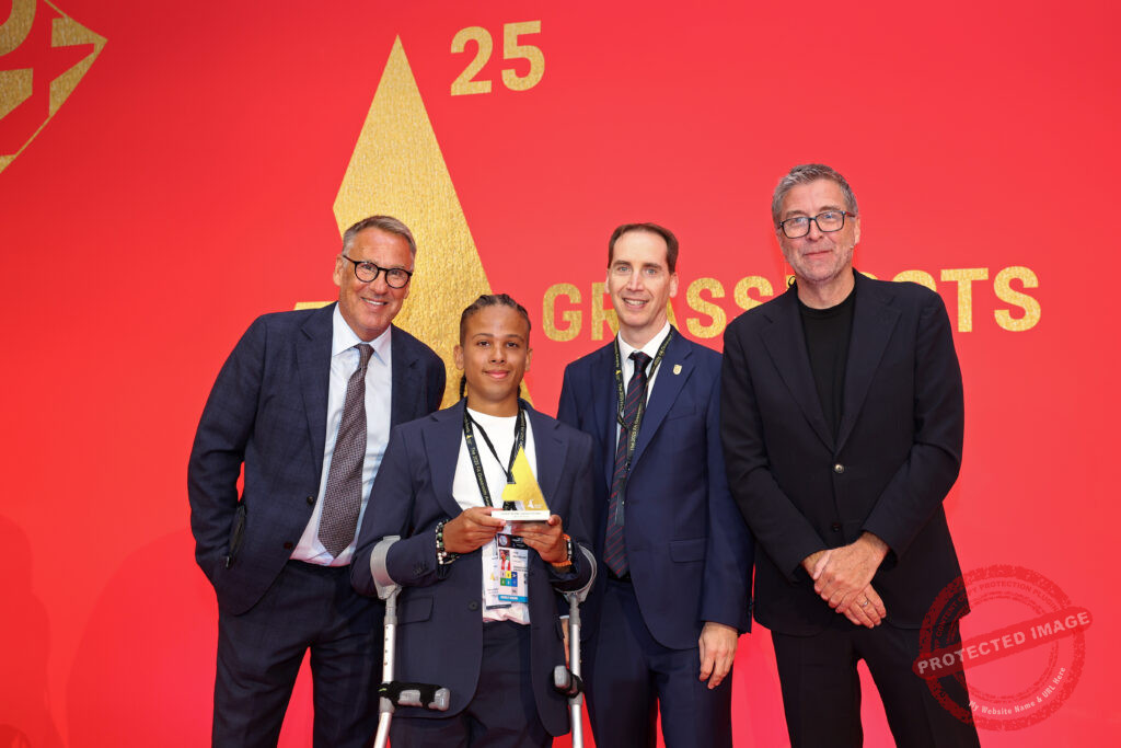 LONDON, ENGLAND - AUGUST 10: Jude Geoghegan poses for a photograph with the Coach of the Year Disability Pathway award alongside Paul Merson, Mark Bullingham and Mark Chapman during the Grassroots Football Awards 2025 at Wembley Stadium on August 10, 2025 in London, England. (Photo by Tom Dulat/The FA via Getty Images)